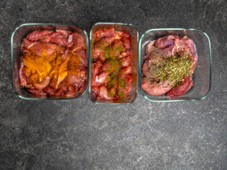 Marinating raw meat in different spices, herbs and marinades, with soy sauce and oil, with copy space