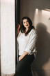 © eosboy - Beautiful plus size body positive brunette girl model in studio