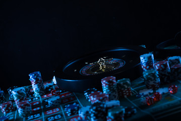 Wall Mural - Casino theme. High contrast image of casino roulette, and poker chips