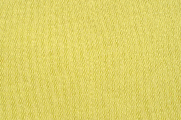 Wall Mural - Yellow knitted background. Jersey texture 