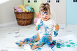 © Olga - Little cute girl draws with finger paints on the floor. Early development concept