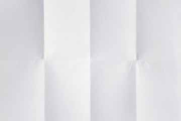 blank white sheet of paper folded 3 times