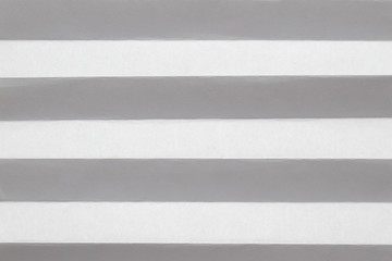 Pleated white sheet of paper. Horizontal lines