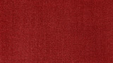 Dark red woven fabric texture background. Closeup
