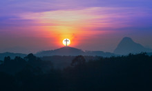 Resurrection Of Jesus Christ Concept: Silhouette Cross On Mountain Sunrise Background