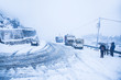 Trees, highway road and vehicle covered with white snow - Image
