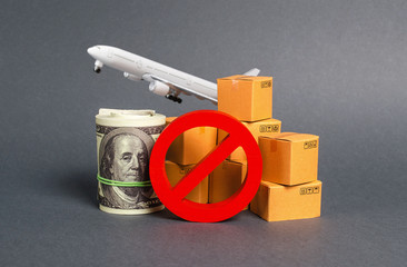 Wall Mural - The prohibition sign NO blocks, bundle of dollars money and boxes with a airplane. Embargo, trade wars. Restriction on importation goods, proprietary for business. Sanctions and economic restrictions