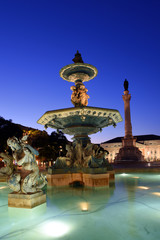 Wall Mural - night view of the bronze fountains at Praca Dom Pedro IV, Rossio square in Lisbon, Portugal