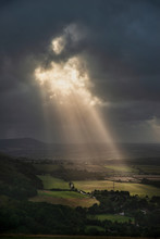 Stunning Summer Landscape Image Of Escarpment With Dramatic Storm Clouds And Sun Beams Streaming Down