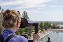 Young Woman Is Looking Through The Tower Viewer