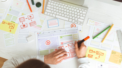 Poster - Website designer creates a sketch application. Developing a project drawing an interface mockup.