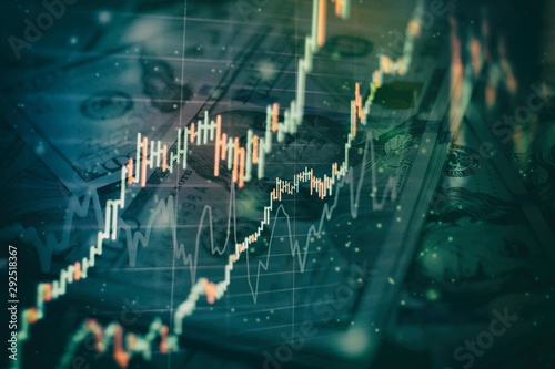 Fotomural Charts of financial instruments with various type of indicators including volume analysis for professional technical analysis on the monitor of a computer