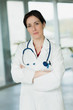 © auremar - portrait of female doctor in hospital lobby