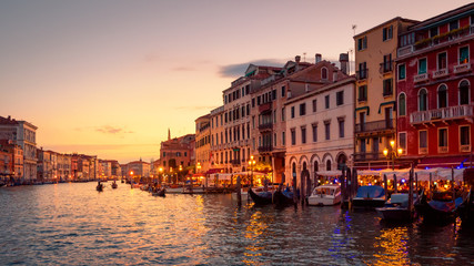 Wall Mural - Venice in summer dusk, Italy. Panorama of famous Grand Canal, famous street of Venice. Beautiful cityscape of Venice with old houses at sunset. Landscape of Venice city in evening light.