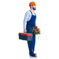 Wall Mural - Man worker builder with helmet and tool belt, tool box on white background isolation