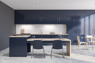 Dark blue kitchen interior with bar and table