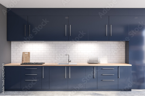 Photographie Gray and brick kitchen with blue countertops
