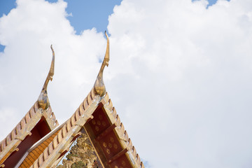 Temple roof with blue sky in Thailand.