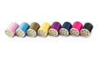 © Aonprom Photo - Colorful sewing thread spool isolated on white background.