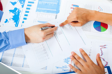 Wall Mural - Business meeting concept, hands and financial charts