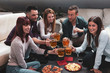 © Marino Bocelli - Happy group of friends drinking beer and eating pizza