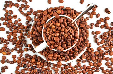 Background of coffee beans and coffee Cup and saucer. Top view.