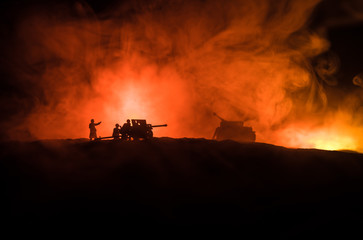 War Concept. Military silhouettes fighting scene on war fog sky background, World War German Tanks Silhouettes Below Cloudy Skyline At night. Attack scene. Armored vehicles and infantry.