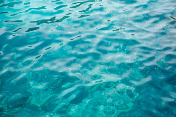 Natural background blue sea with waves, azure clear water beach. Aerial top view