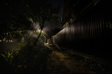 Wall Mural - full moon over quite village at night. beautiful night landscape of old town street with lights. rus