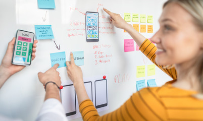 Designers drawing website ux app development.