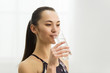 © Prostock-studio - Millennial woman drinking clean fresh water after training