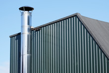 Flue Chimney Fixed To Building Exterior Wall Stainless Steel From Exhaust Boiler Plant Room