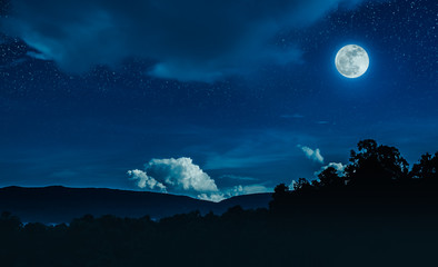 Wall Mural - landscape of blue night sky with many stars and beautiful full moon.