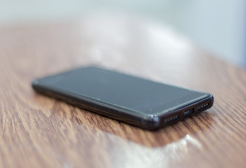 black smartphone on the table