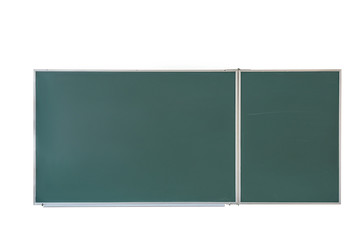 Empty green chalkboard with traces of chalk in school classroom isolated