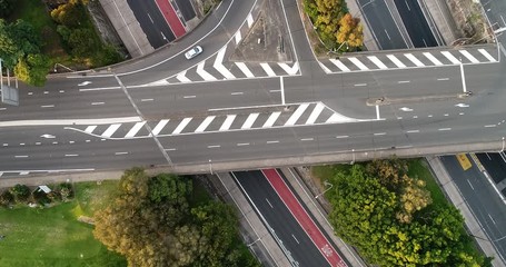 Poster - Local roads over Warringah freeway – lifting up along multi-lane highway towards North Sydney and distant city CBD.