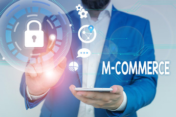 Poster - Word writing text M Commerce. Business photo showcasing commercial transactions conducted electronically by mobile phone Male human wear formal work suit presenting presentation using smart device