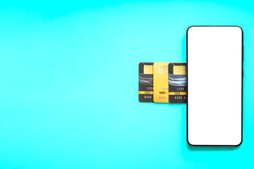 Poster - Credit cards and smartphone on blue background.
