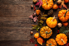 Autumn Decorative Pumpkins With Fall Leaves On Wooden Background. Thanksgiving Or Halloween Holiday, Harvest Concept. Top View, Copy Space. Greeting Card