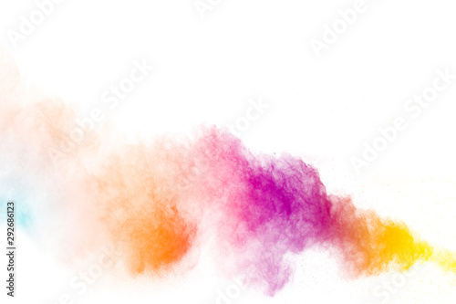 Colorful background of pastel powder explosion.Multi colored dust splash on w...