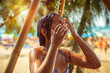 © Anna Om - Little girl taking shower on the beach