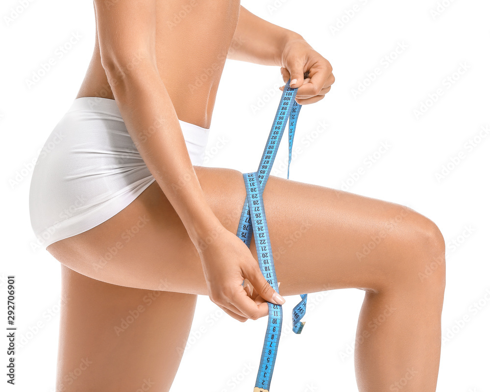Beautiful young woman with measuring tape on white background. Weight loss concept
