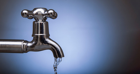 Drain water from the Metal tap, Water flowing from modern faucet