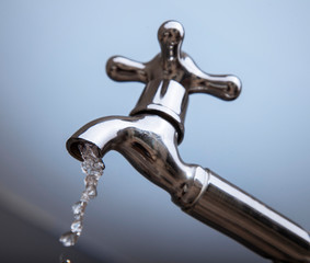 Drain water from the Metal tap, Water flowing from modern faucet