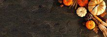 Fall Corner Border Banner Of Pumpkins And Autumn Decor On A Dark Stone Background With Copy Space