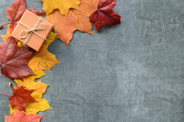 Wall Mural - autumn composition. maple leaves and gift box. flat lay, top view