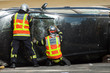 © pixarno - portrait on back view of french rescue man on crashed car