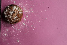 Cupcake With Powdered Sugar On A Blue Background On Pink