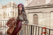© Victoria Fox - Outdoor fashion portrait of young elegant, luxury brunette woman wearing dark red faux leather beret, skirt, snakeskin print blouse, beige sunglasses, holding brown handbag. Copy, empty space for text