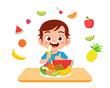 cute happy kid eat salad vegetable fruits
